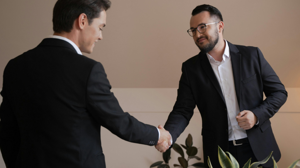 Two business men shaking hands